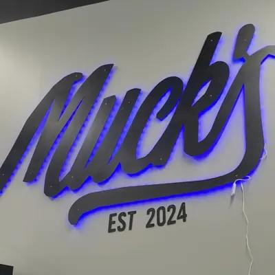 Logo for Muck's Pickleball and Social Club