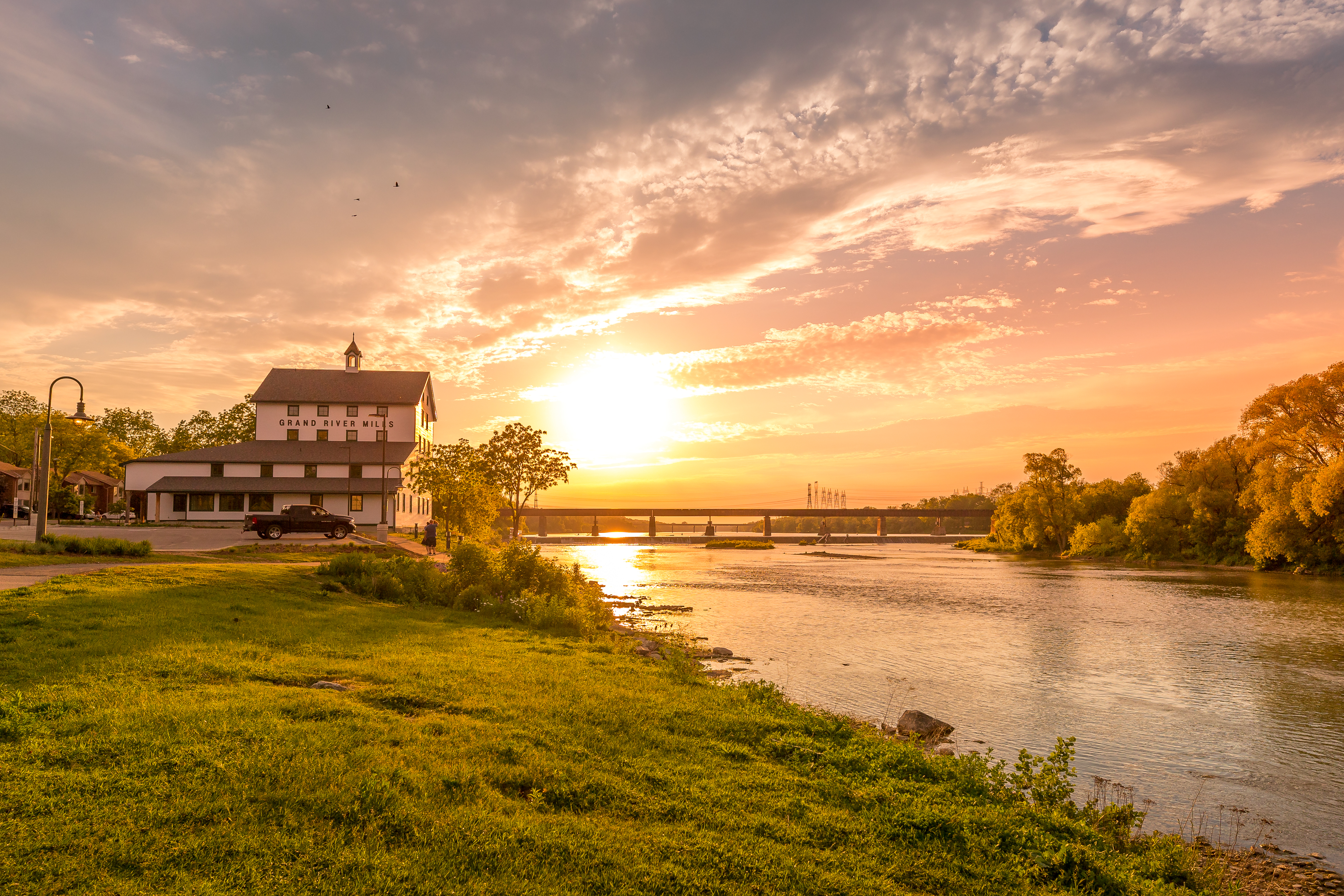 Caledonia Old Mill and Train bridge with sunset behind