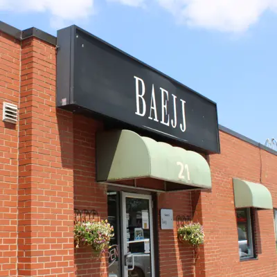 Exterior of building with sign saying Baejj