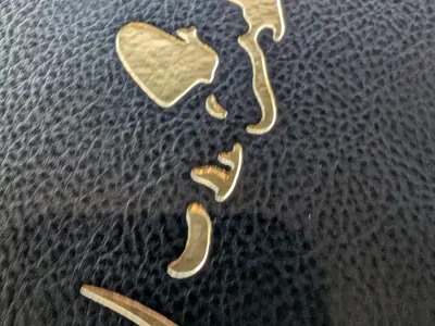 Embossed menu cover with drawing of Big Pete