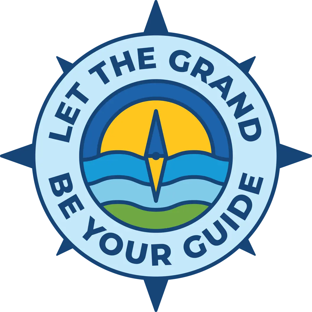 A compass logo with waves of green and blue and an yellow sun in the centre Let the Grand Be Your Guide