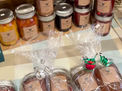 jars of jam lined up and wrapped for the holidays