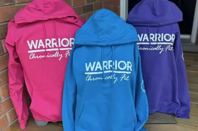 Bright coloured sweatshirts emblazoned with the word Warriors