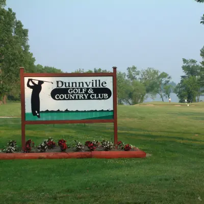 dunnville golf sign with flower bed underneath and golf course behind