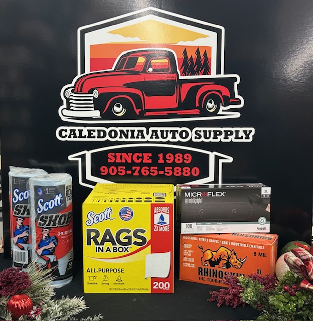 A selection of auto buffing pads and rags in front of their logo