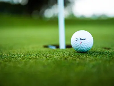 golf ball almost in the hole