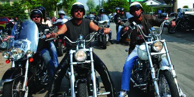 3 men on motorcycles