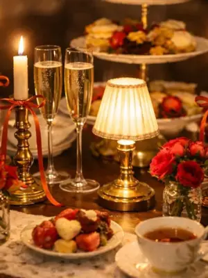 a table is set in red and gold with high tea served