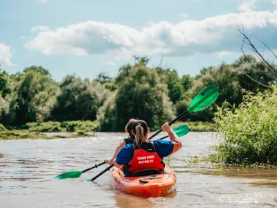 two people paddling a kayak