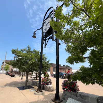 millenium clock tower in front of parking lot
