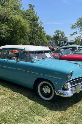 old cars lined up at an event