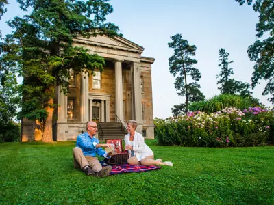 Couple having a picnic in front of Ruthven National Historic Site