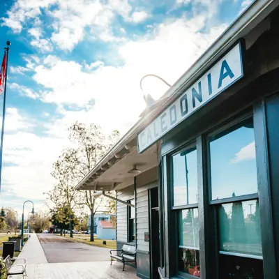 a historic train station with sign "caledonia"