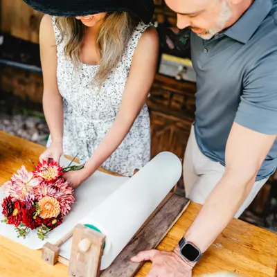2 people making a bouquet