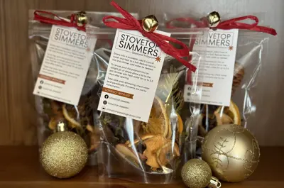 Bags of festive cellophane bags full of dried fruit sit on a countertop